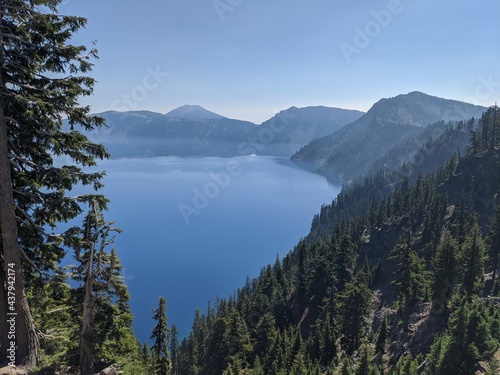 Crater Lake Oregon Blue water lake with trees surrounding
