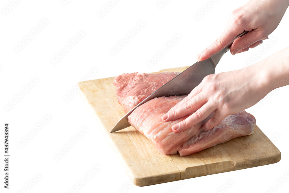 cutting pork meat into slices isolated on white background