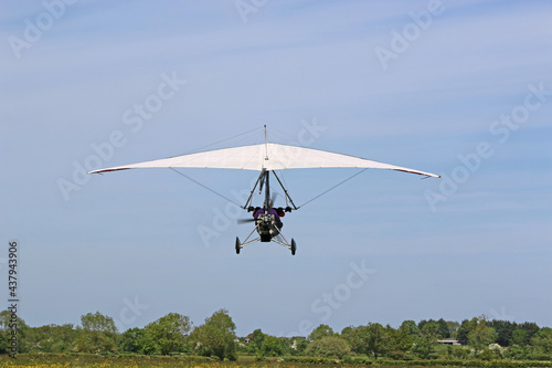 Valokuva Ultralight airplane flying in a blue sky