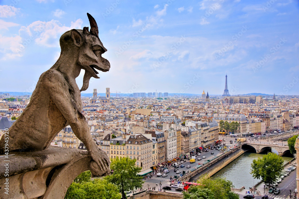 Notre Dame gargoyle overlooking the Paris cityscape with Siene River and Eiffel Tower