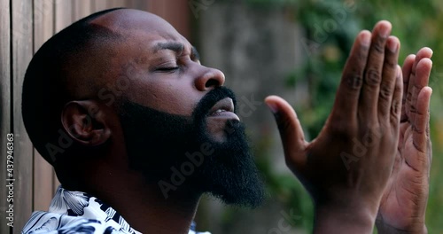 African man praying to God, person asking for divine help, begging for support