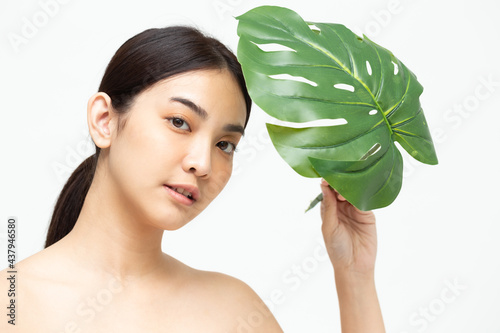 Young Asian woman beauty with natural green leaf isolated on white background, Spa skin care and beauty treatment concept