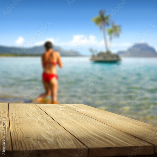Desk of free space and summer background of sea and beach 