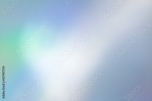 Blurred rainbow light refraction texture overlay effect for photo and mockups. Organic holographic flare on a white wall. Shadows for natural light effects.