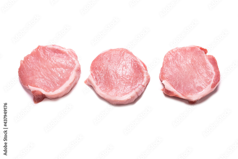 Raw pork pieces isolated on a white background.
