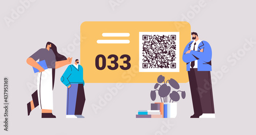 people looking at display number board in waiting room electronic queuing system queue management customer service