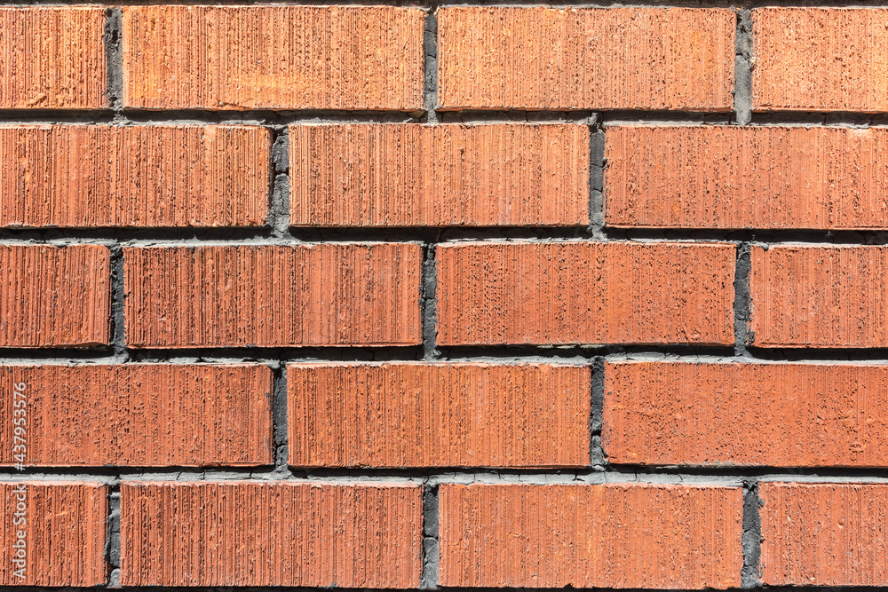 Obraz premium The texture of a stone wall made of red clay bricks. As a natural abstract background.