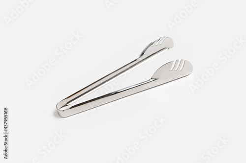 Serving kitchen cooking Tongs isolated on a White Background. High-resolution photo.