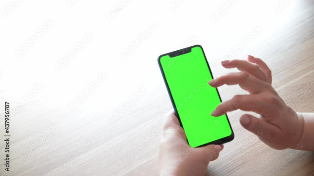 Phone hand chroma key Green screen Mock-up for watching Content Close-up. Swiping Left and Center Click for Web Surfing of Store. Vertical smartphone display. Phone hand chroma key Green screen Mock-up for watching Content Close-up. Swiping Left and Center Click for Web Surfing of Store. Vertical smartphone display.