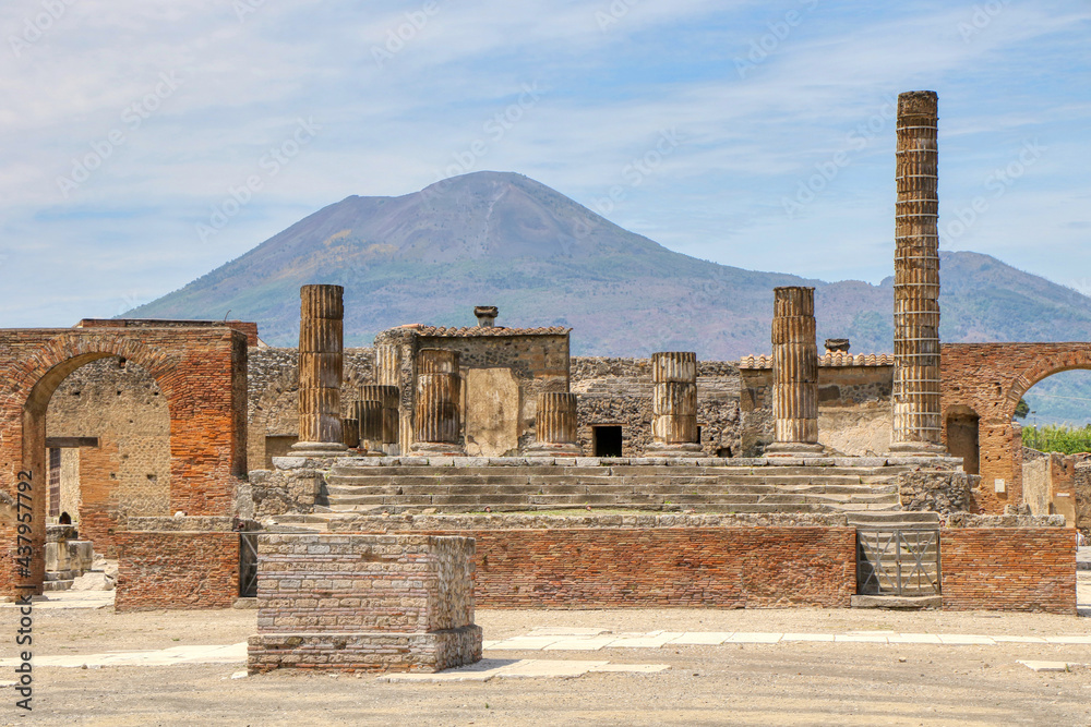 Archaeological Park of Pompeii. Temple of Jupiter with Mount Vesuvius in the background. Campania, Italy