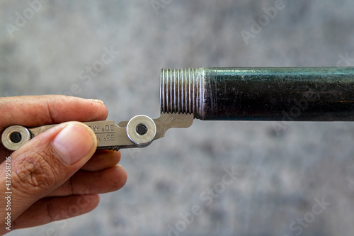 Measurement the pipe threads with thread pitch gauge or screw pitch gauge.