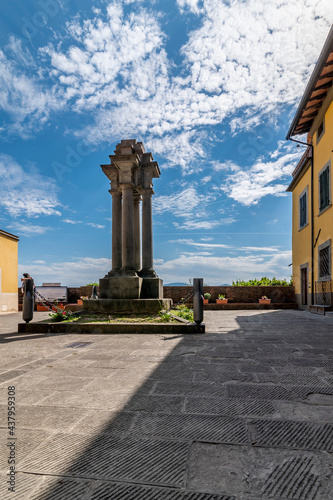 The war memorial in the Piazza Carrara square in the center of Montecarlo, Lucca, Italy, under a beautiful sky