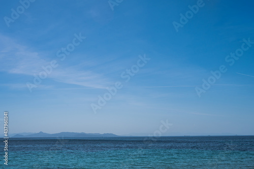 Scenic landscape of Aegean sea at sunny summer day. Athens, Greece. Silhouettes of islands in mist.