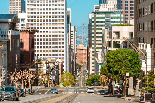 Canvas Print A street in the center of the city with a sloping road and a beautiful view of the downtown