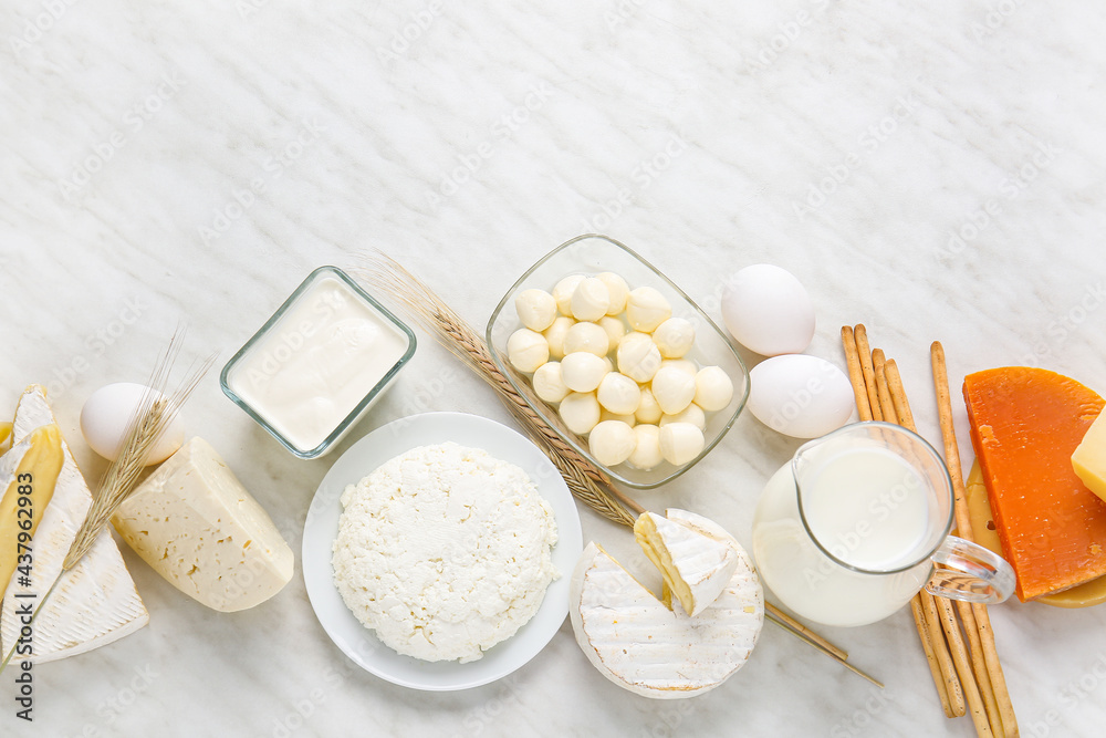 Different dairy products and chicken eggs on light background Different dairy products and chicken eggs on light background