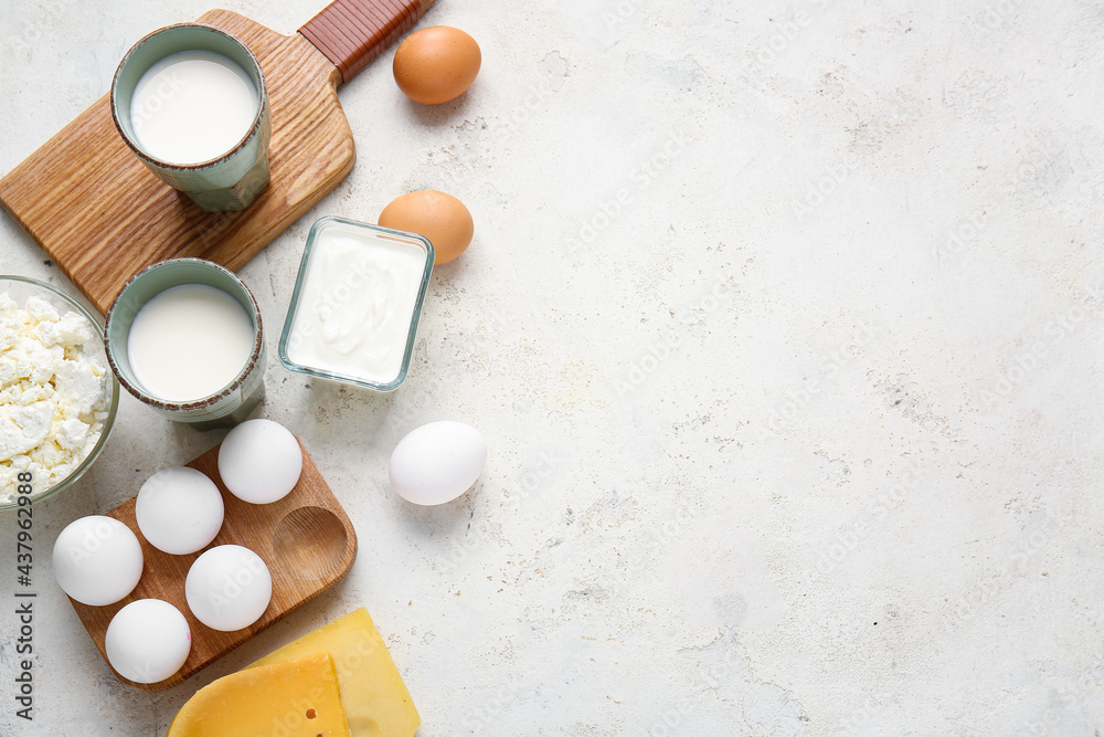 Different dairy products and chicken eggs on light background Different dairy products and chicken eggs on light background