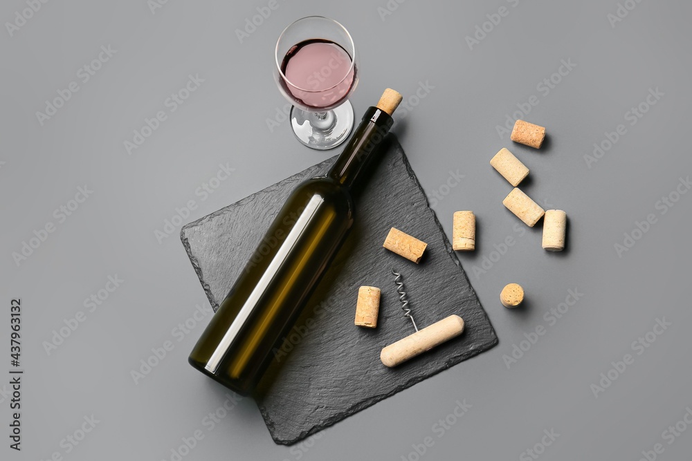 Composition with bottle of wine on dark background Composition with bottle of wine on dark background