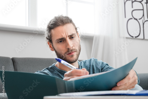Handsome young man working ...