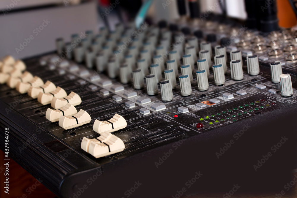 Old fashioned music sound mixer. Professional audio mixing console for DJ with buttons, faders and sliders. Old fashioned music sound mixer. Professional audio mixing console for DJ with buttons, faders and sliders.