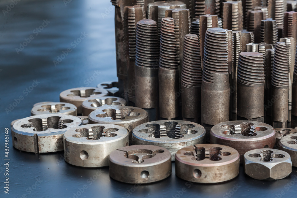 Taps and dies for metal threading. Tools for cutting external and