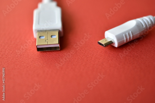 White USB PC cable on red background