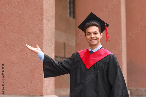 Portrait of male graduating...