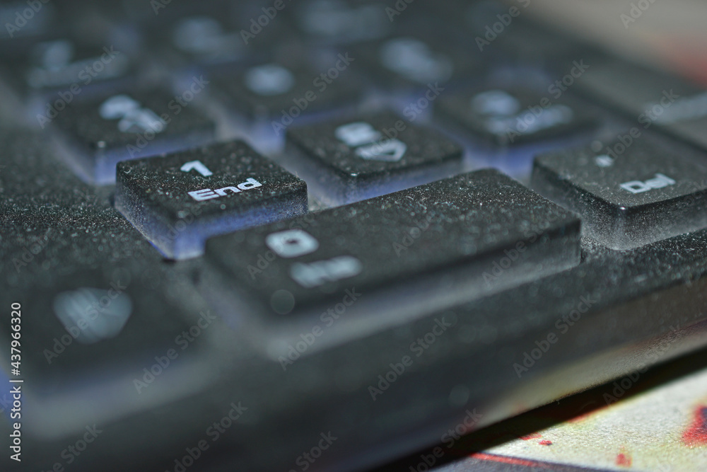 Dusty black PC keyboard close-up in the evening Dusty black PC keyboard close-up in the evening