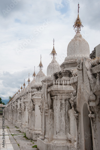 Elaborate white stone wall in Myanmar photo