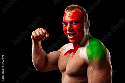 Italy fan. Soccer or football athlete with flag bodyart on face. Sport concept with copyspace.