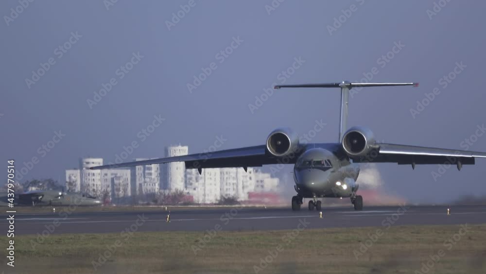 Military airplane is taxiing on the runway after landing Military airplane is taxiing on the runway after landing