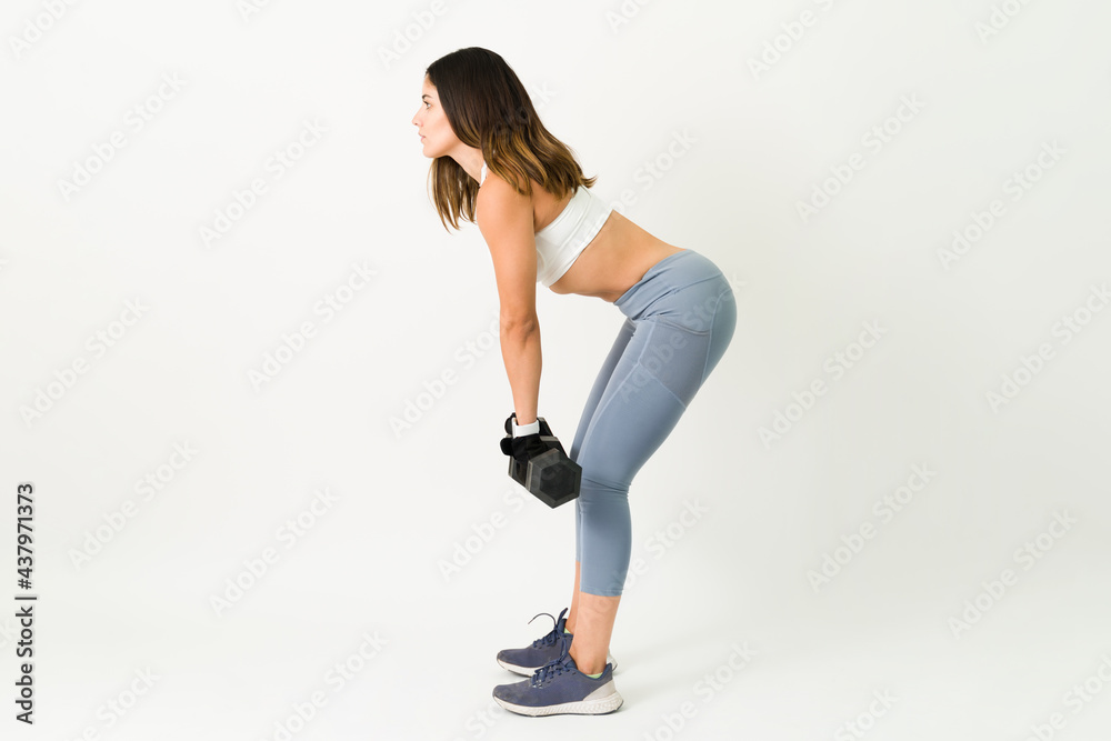 Fitness woman exercising and lifting weights Fitness woman exercising and lifting weights