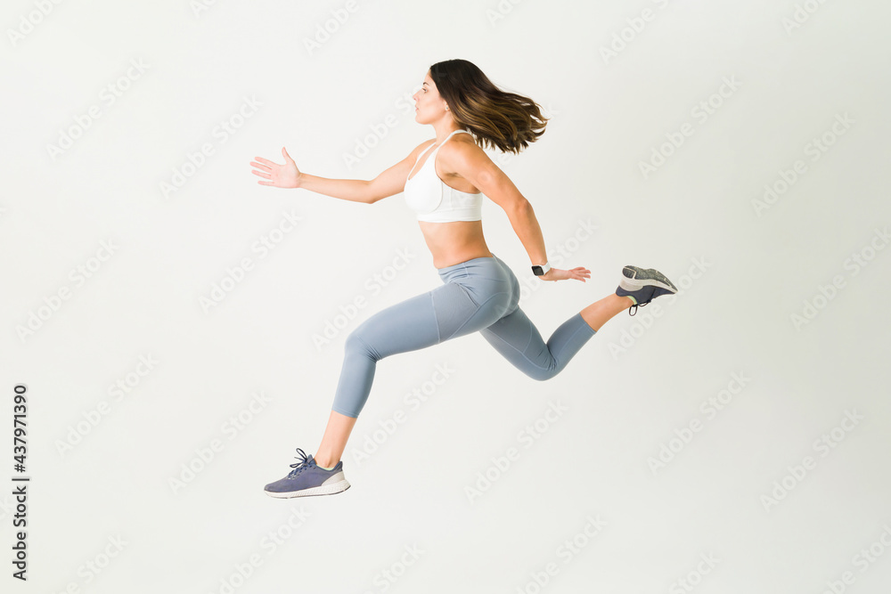 Fit female athlete during a cross-training Fit female athlete during a cross-training