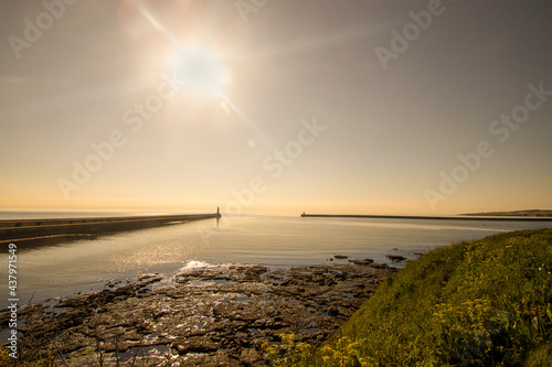 Sunrise over the entrance to Tynemouth Harbour in Tyne and Wear, UK photo