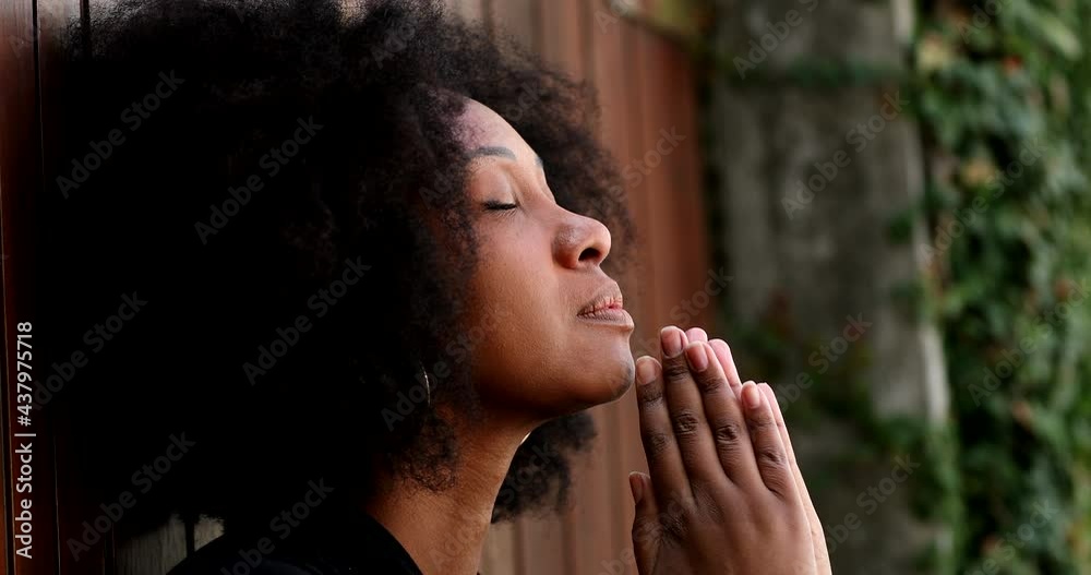 Meditative black woman in peace outside eyes closed Meditative black woman in peace outside eyes closed