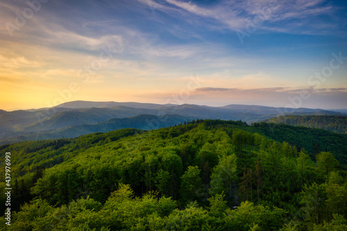 Fototapeta Naklejka Na Ścianę i Meble -  Panorama of the Silesian Beskids from Rownica peak at sunrise. Poland