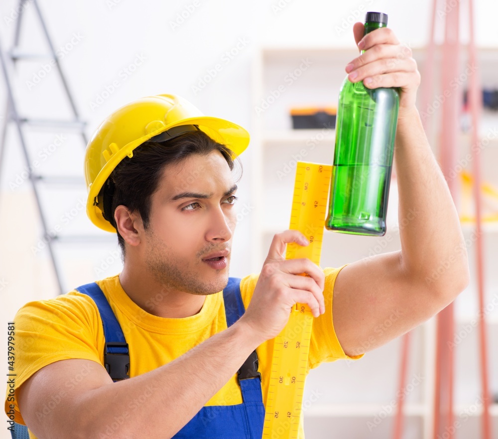 Drunk engineer working in the workshop Drunk engineer working in the workshop
