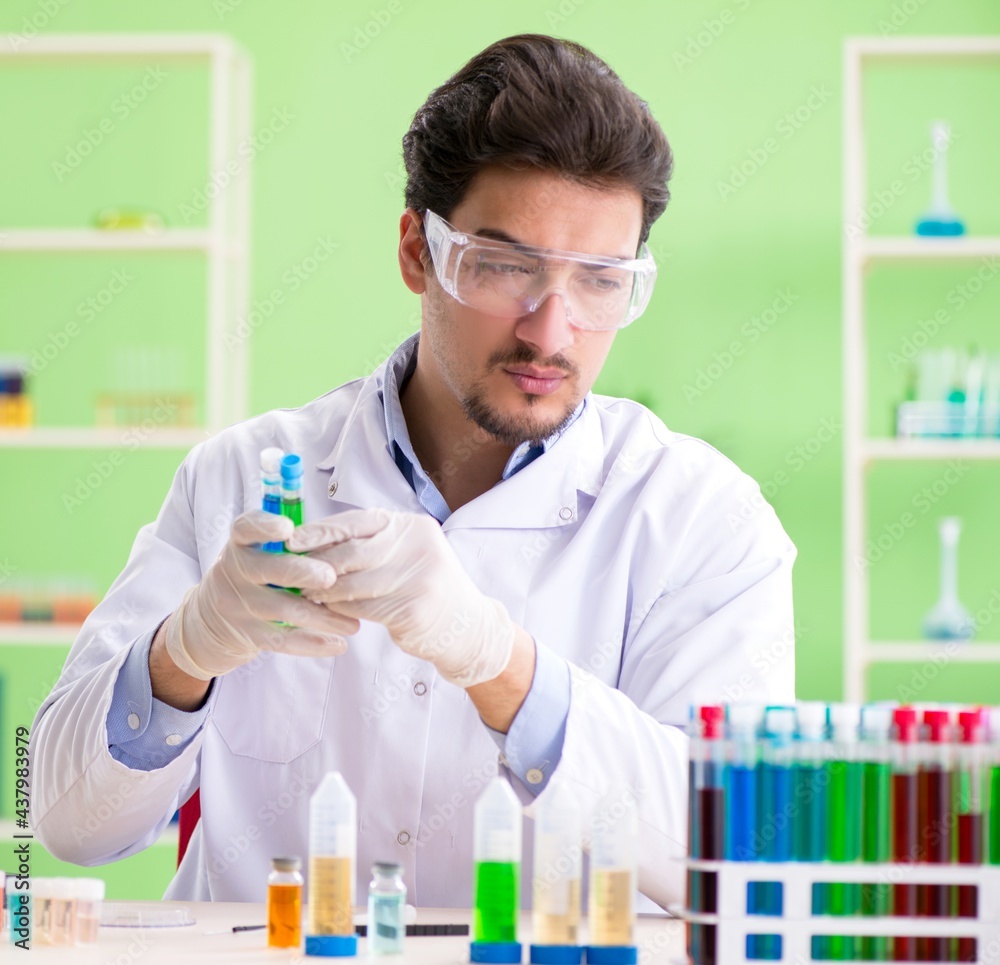 Man chemist working in the lab