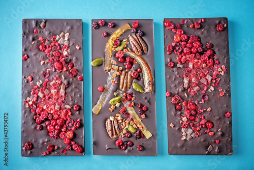 Handmade dark chocolate with berries and nuts photo