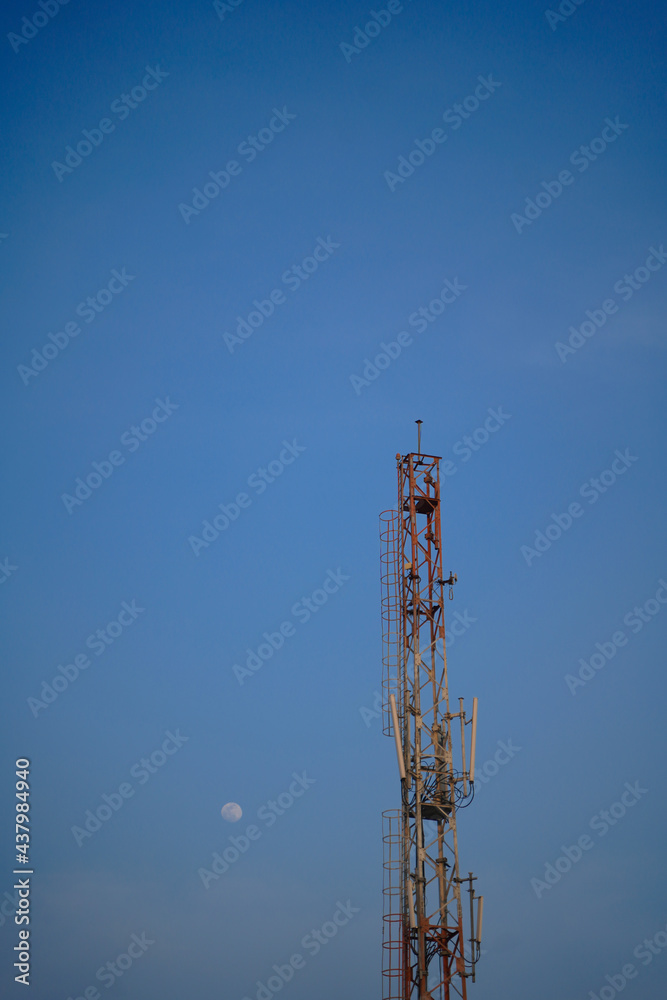 Telecommunication cell tower isolated over blue sky