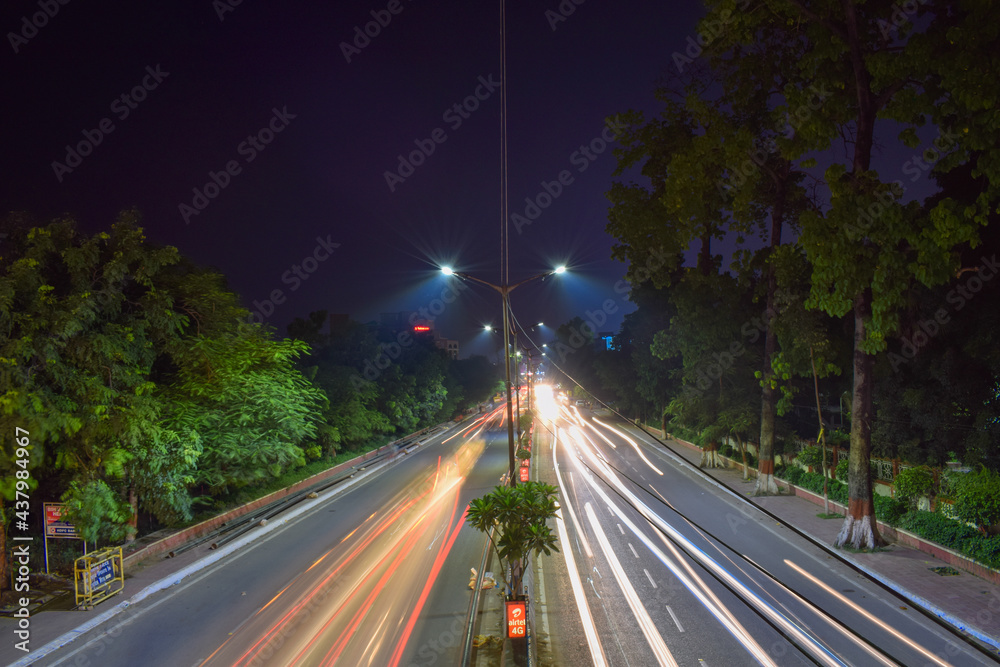 Long exposure photo of an Indian roadway, vehicle in motion