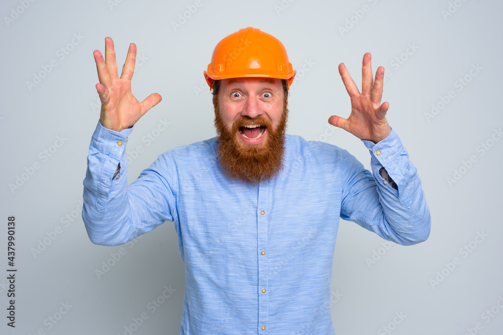 Isolated happy architect with beard and orange helmet Isolated happy architect with beard and orange helmet