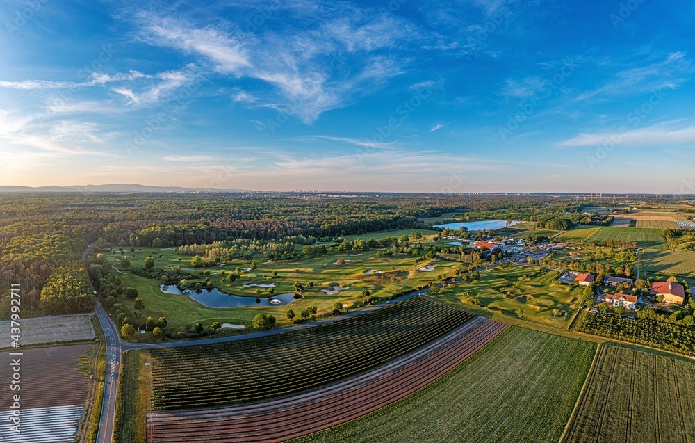 Drone image of golf course near Frankfurt in Germany with skyline in background