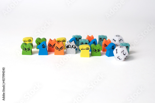 Small, wooden animal figurines for a board game on a white background. photo