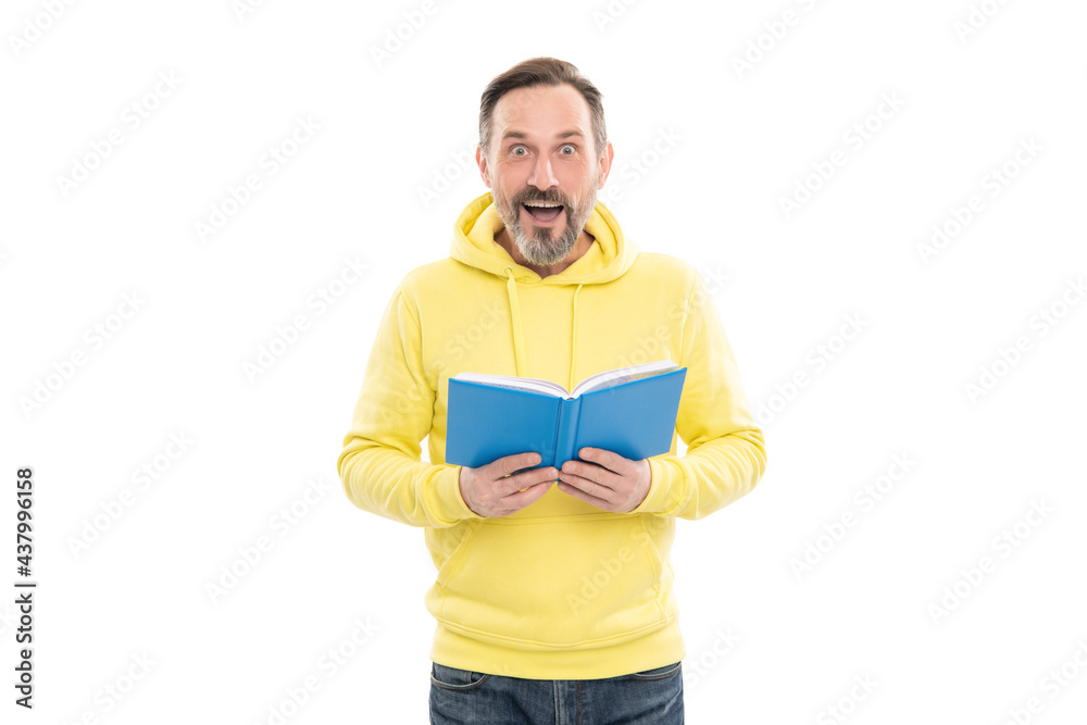 surprised senior guy with notepad isolated on white. caucasian man in yellow hoody planning his work. surprised senior guy with notepad isolated on white. caucasian man in yellow hoody planning his work.