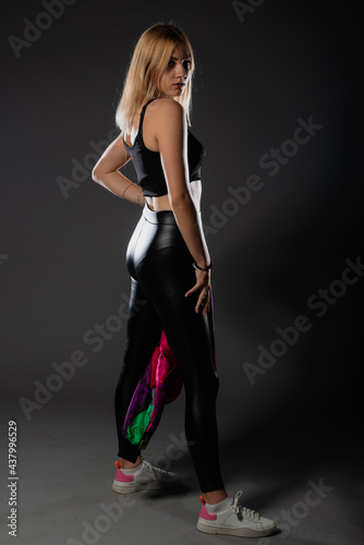 Sexy blonde in leather black pants going crazy.