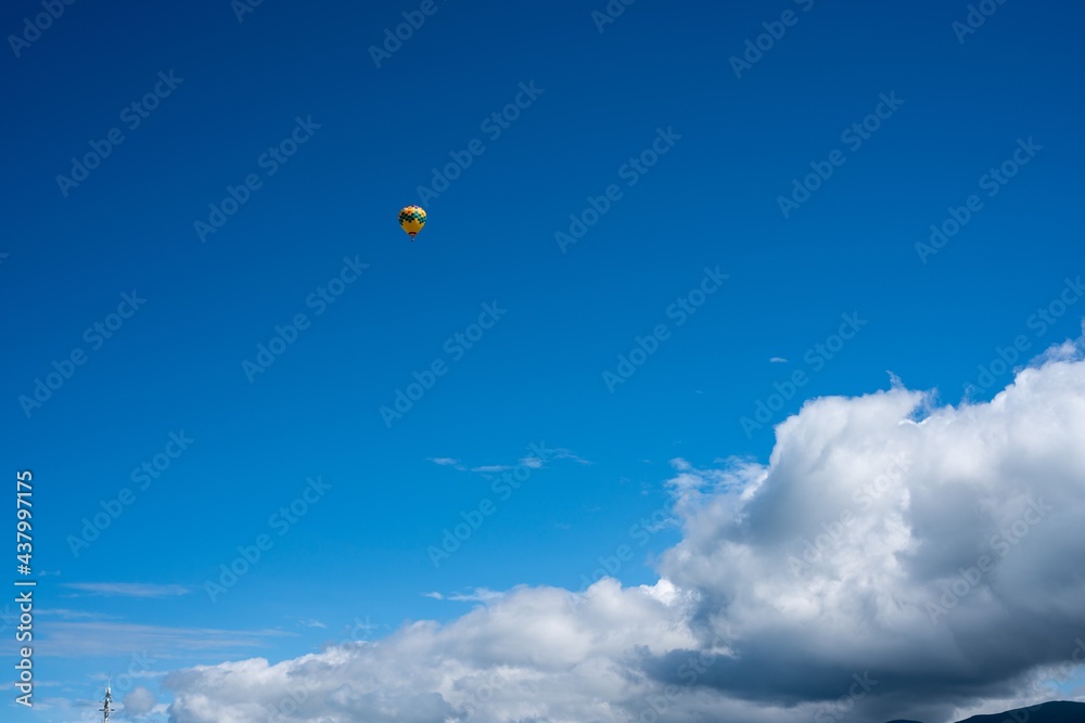 Hot air balloon flying in the sky Hot air balloon flying in the sky