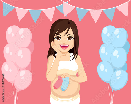 Beautiful young mother with pink and blue socks on baby shower gender reveal party