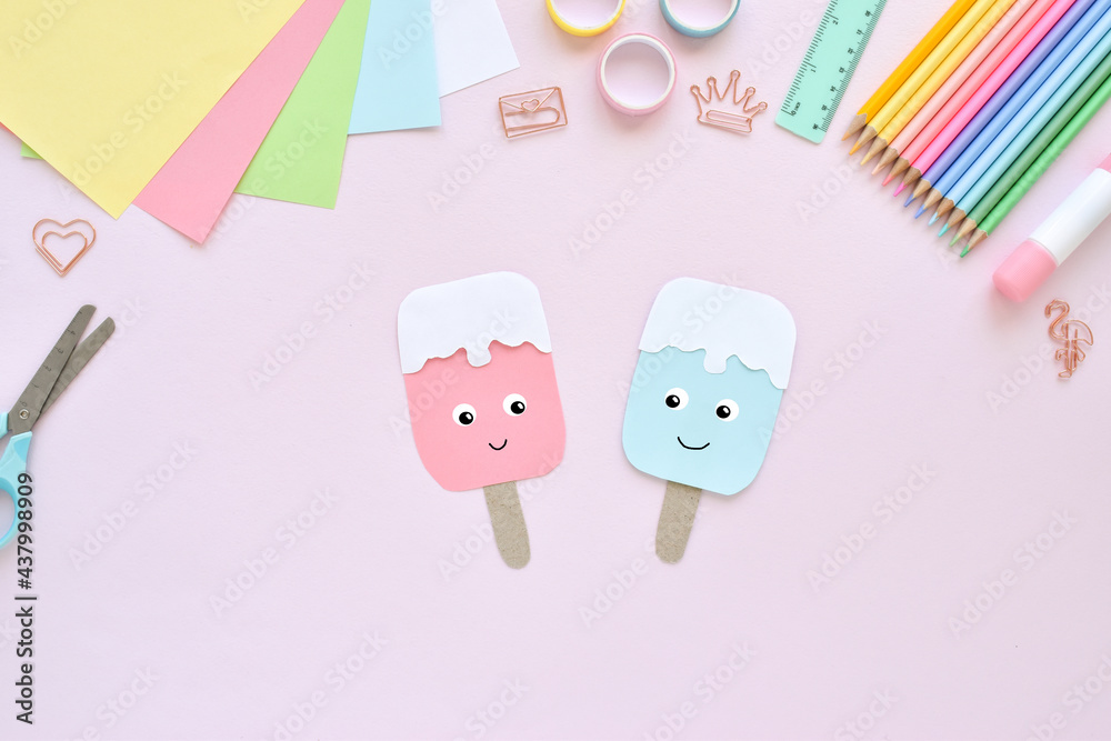 DO IT YOURSELF. Paper ice cream with kids at home. Step-by-step instructions. Top view. Step 3. The colored paper popsicle is ready. Popsicle DO IT YOURSELF. Paper ice cream with kids at home. Step-by-step instructions. Top view. Step 3. The colored paper popsicle is ready. Popsicle
