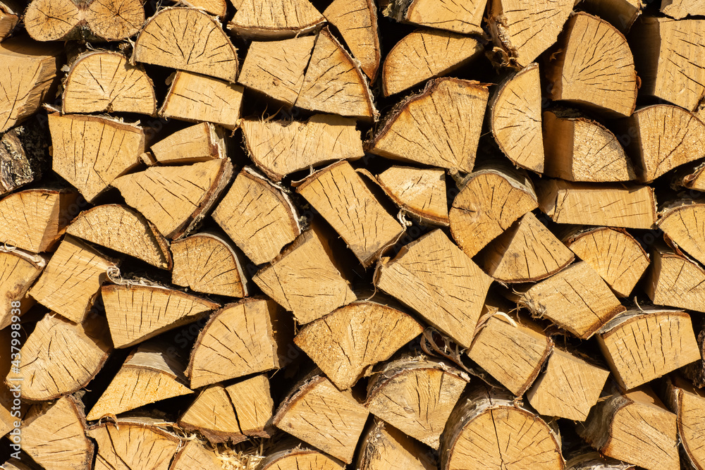 Stacked woodpile of firewood, structured wood background for design. Stacked woodpile of firewood, structured wood background for design.