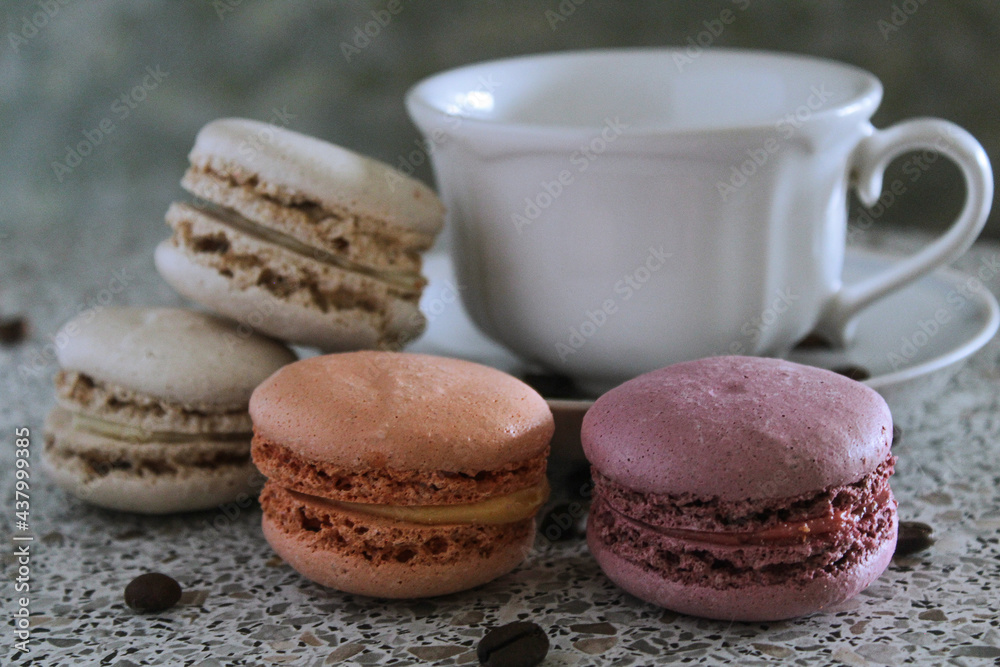 macaroons and cup of coffee on the table sweet cakes